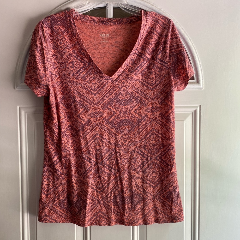 Print tribal design on peach shirt